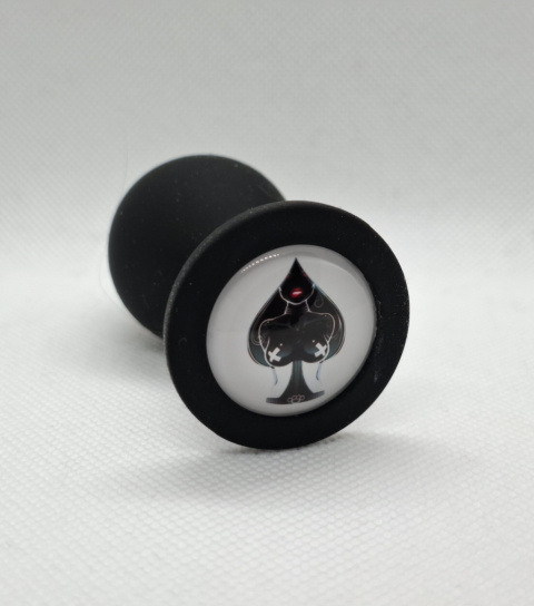Czarny korek analny z motywem karty pik i kobiecej sylwetki w środku